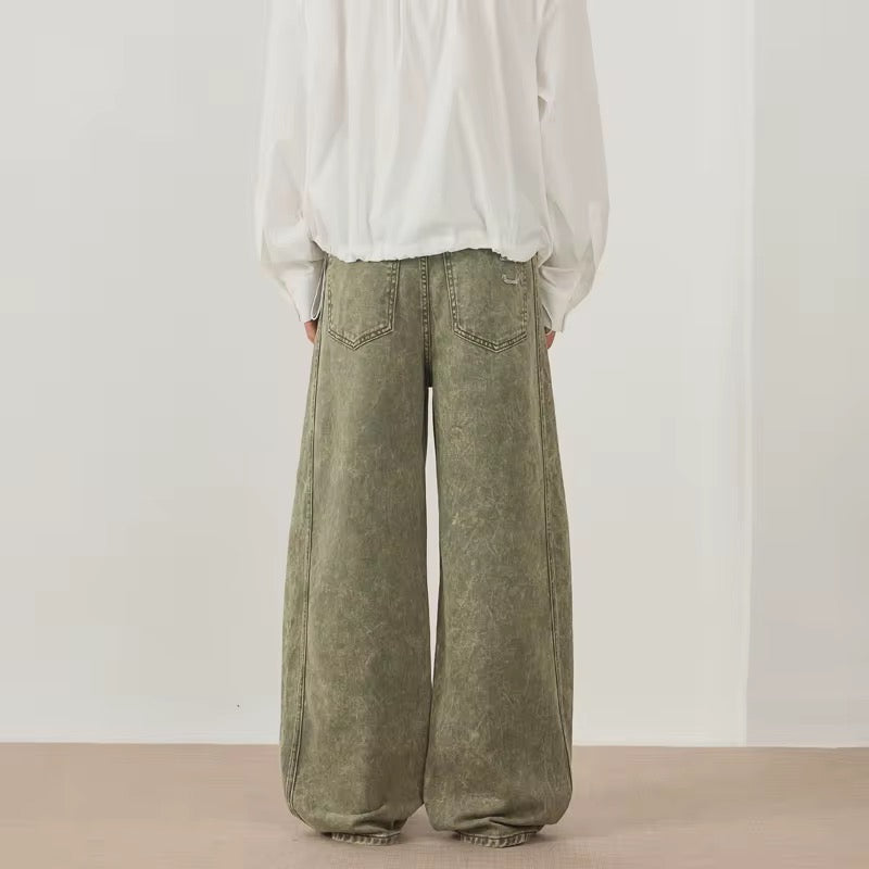 Green distressed denim