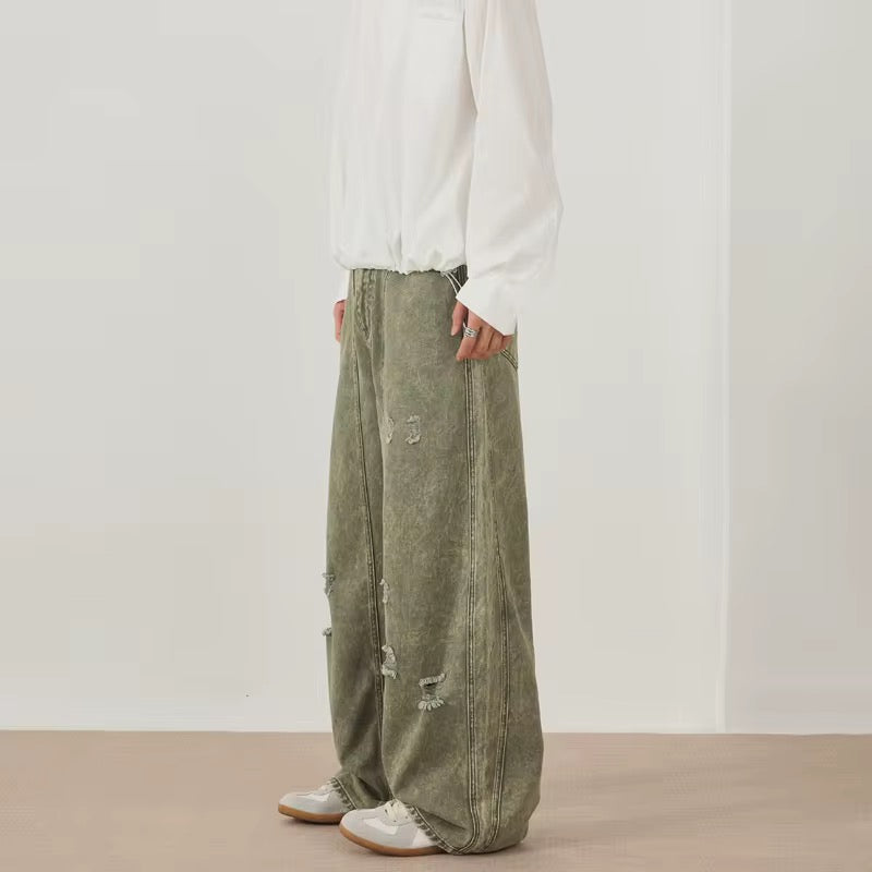 Green distressed denim