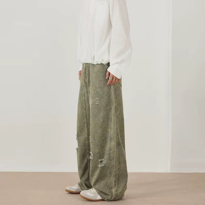 Green distressed denim